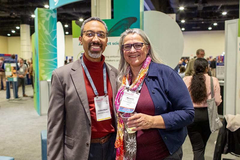 two people smiling at conference