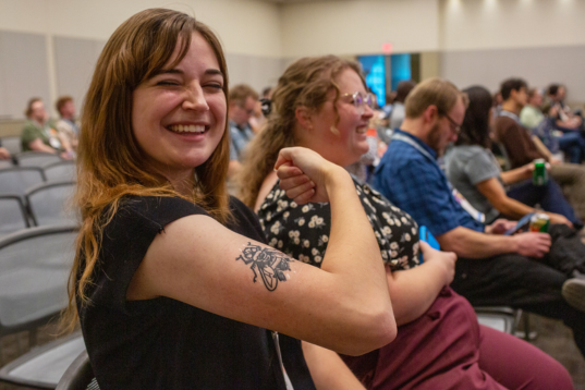 Smiling tattoo on arm girl